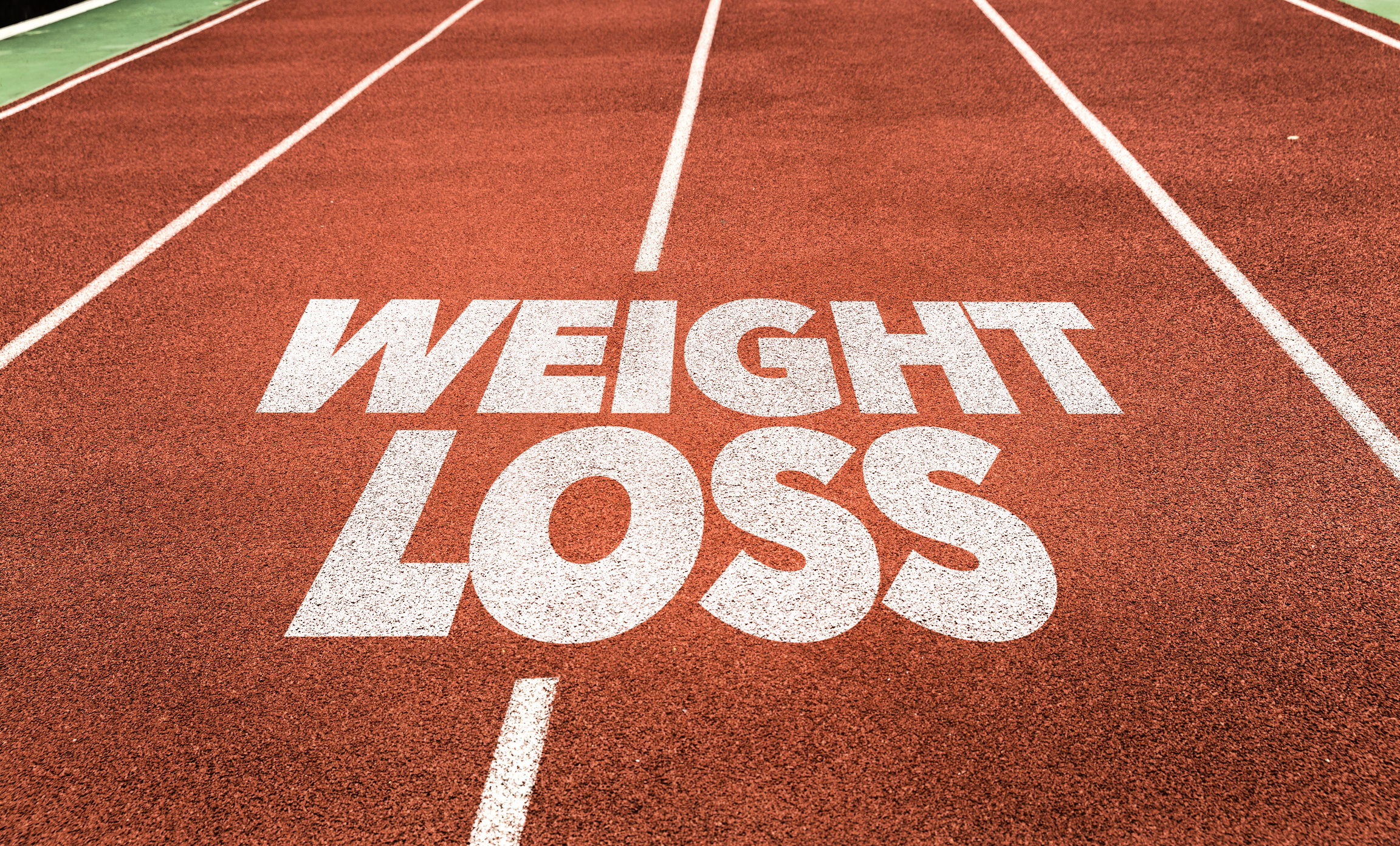 Weight Loss Sign on a Running Track 